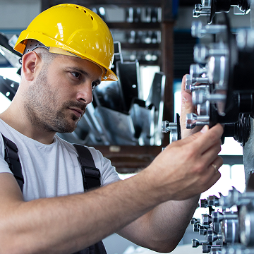 Worker checking compressor